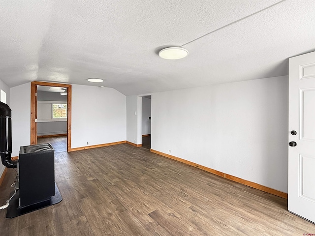 1246 Meeker St, Delta, CO 81416 - unfurnished living room with wood finished floors, baseboards, a textured ceiling, and lofted ceiling