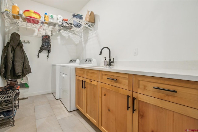 225 Hay Barn Rd, Durango, CO 81301 - laundry area with washer and dryer, cabinet space, and light tile patterned flooring