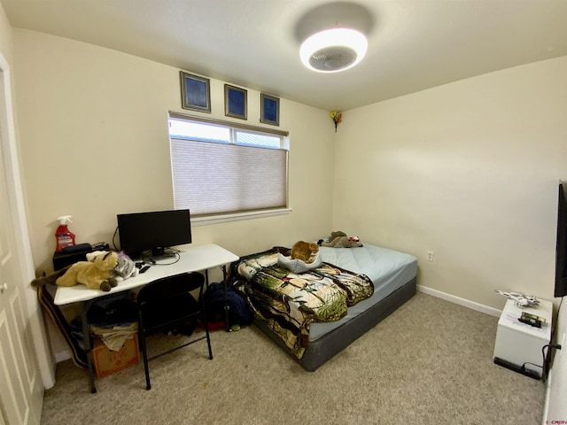 308 S 11th St Unit 1, Gunnison, CO 81230 - carpeted bedroom with a desk and baseboards