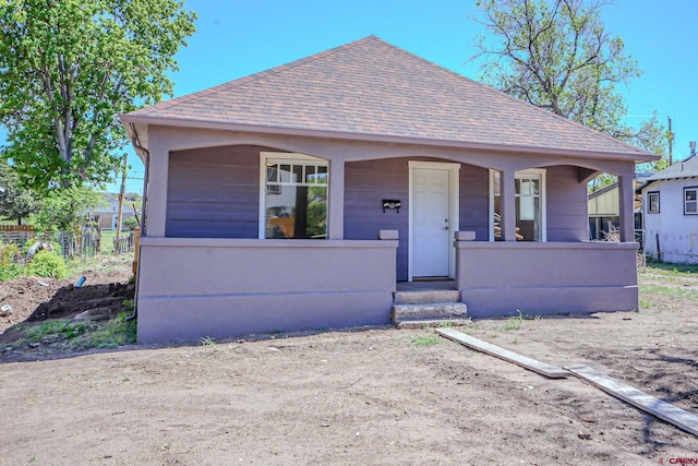 327/327.5 E 7th St, Walsenburg, CO 81089 - view of front facade with roof with shingles and covered porch