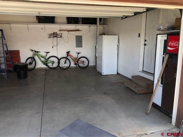 22 Lancer Ct, Pagosa Springs, CO 81147 - garage featuring freestanding refrigerator and electric panel