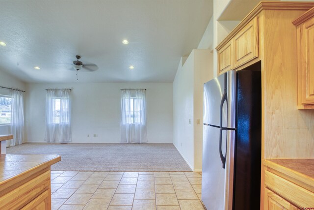 2038 Park Ave, Pagosa Springs, CO 81147 - kitchen featuring freestanding refrigerator, light carpet, light brown cabinetry, a ceiling fan, and recessed lighting