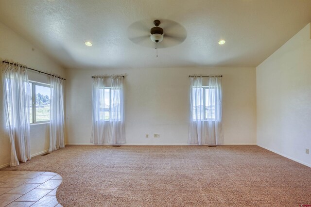2038 Park Ave, Pagosa Springs, CO 81147 - empty room featuring healthy amount of natural light, a ceiling fan, light colored carpet, baseboards, and recessed lighting