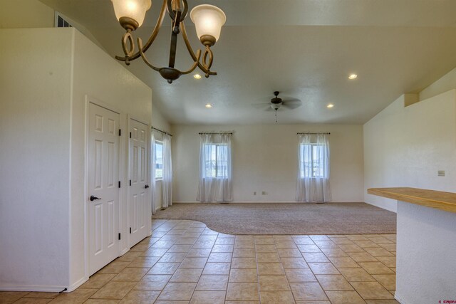 2038 Park Ave, Pagosa Springs, CO 81147 - foyer with recessed lighting, a chandelier, ceiling fan, light colored carpet, and baseboards