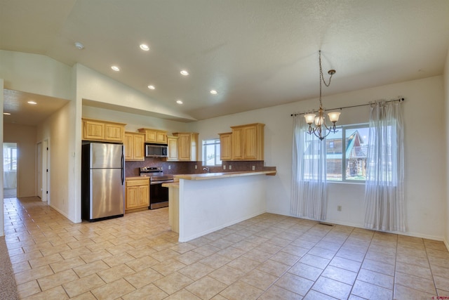 2038 Park Ave, Pagosa Springs, CO 81147 - kitchen with appliances with stainless steel finishes, a chandelier, recessed lighting, a peninsula, and lofted ceiling