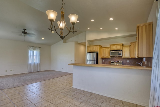 2038 Park Ave, Pagosa Springs, CO 81147 - kitchen featuring appliances with stainless steel finishes, recessed lighting, a chandelier, vaulted ceiling, and ceiling fan