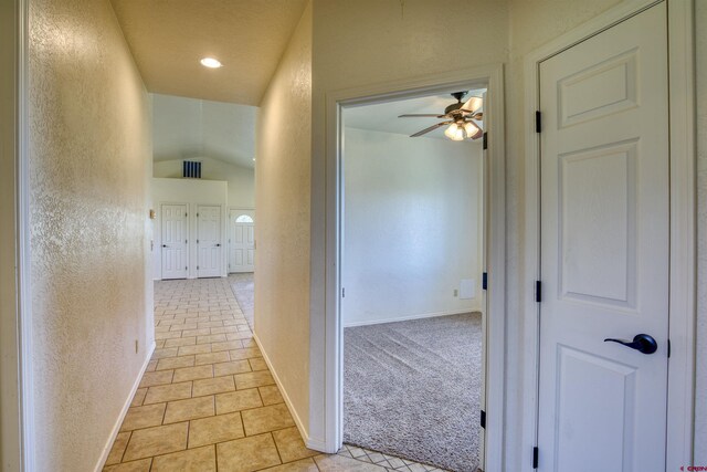 2038 Park Ave, Pagosa Springs, CO 81147 - hall featuring a textured wall, light tile patterned floors, and baseboards