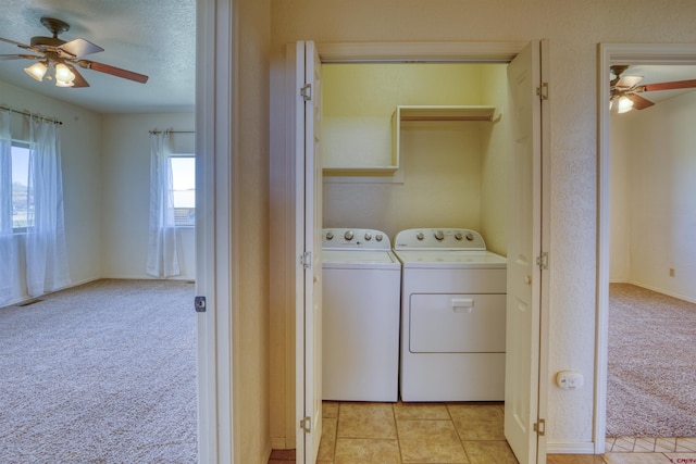 2038 Park Ave, Pagosa Springs, CO 81147 - washroom with separate washer and dryer, ceiling fan, light carpet, a textured ceiling, and baseboards