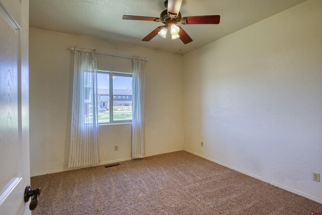 2038 Park Ave, Pagosa Springs, CO 81147 - carpeted spare room with a ceiling fan and baseboards