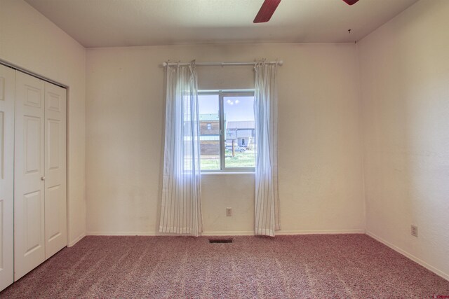 2038 Park Ave, Pagosa Springs, CO 81147 - unfurnished bedroom with carpet flooring, a closet, a ceiling fan, and baseboards