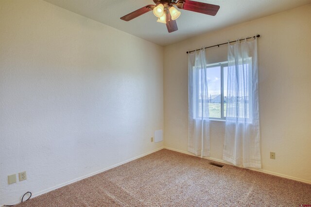 2038 Park Ave, Pagosa Springs, CO 81147 - empty room with carpet floors, a ceiling fan, and baseboards