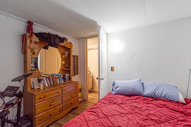 3268 E Rd Unit 1, Clifton, CO 81520 - bedroom featuring wood finished floors and a textured ceiling