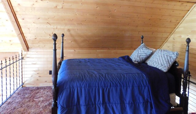 11787 Castle Rock Rd, Del Norte, CO 81132 - bedroom featuring wood walls and wooden ceiling