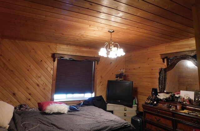 11787 Castle Rock Rd, Del Norte, CO 81132 - bedroom featuring wooden walls, a chandelier, and wooden ceiling