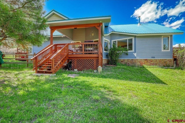 165 Twin Creek Cir, Pagosa Springs, CO 81147 - rear view of property featuring metal roof, a deck, and stairway