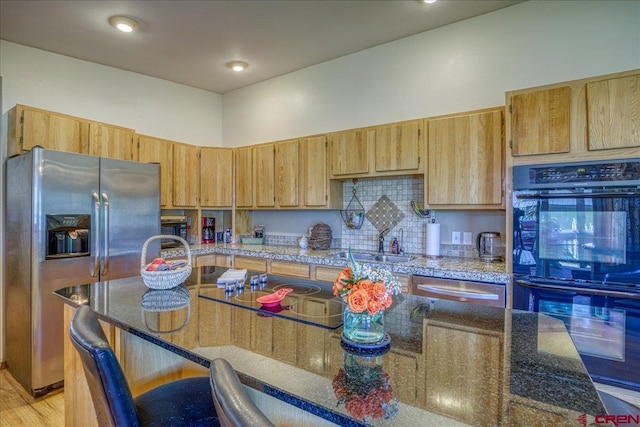 165 Twin Creek Cir, Pagosa Springs, CO 81147 - kitchen with black appliances, a sink, dark stone countertops, and light wood-type flooring
