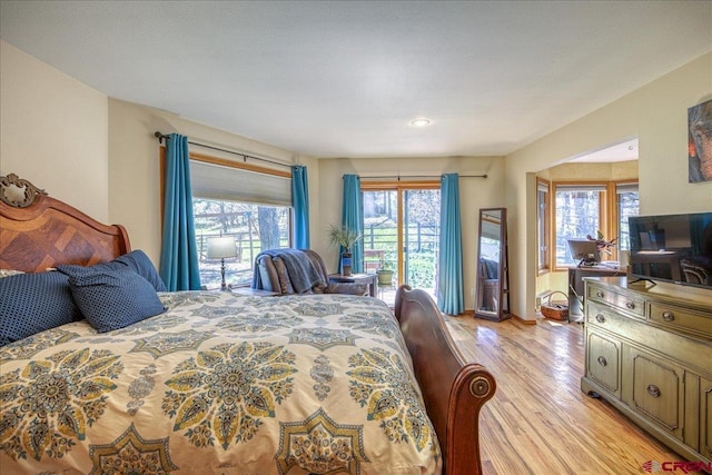 165 Twin Creek Cir, Pagosa Springs, CO 81147 - bedroom featuring light wood-style flooring and access to exterior