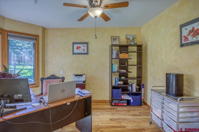 165 Twin Creek Cir, Pagosa Springs, CO 81147 - office area featuring wood finished floors, ceiling fan, baseboards, and a textured wall
