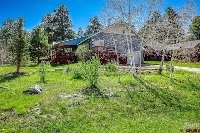 165 Twin Creek Cir, Pagosa Springs, CO 81147 - view of property exterior featuring driveway, a deck, and a garage
