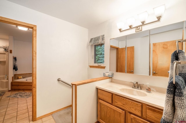 37 Verde Ln, Durango, CO 81301 - full bathroom with vanity, a tub to relax in, and tile patterned floors