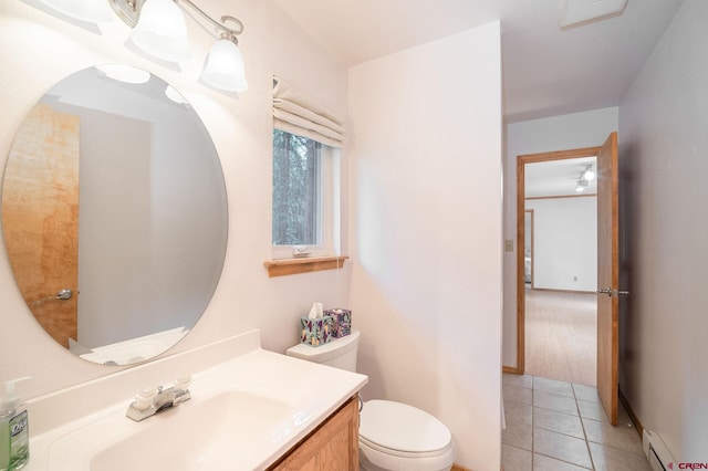 37 Verde Ln, Durango, CO 81301 - bathroom with baseboard heating, toilet, vanity, and tile patterned flooring