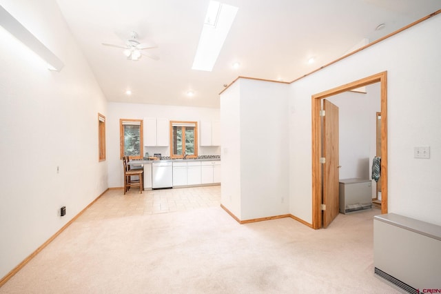 37 Verde Ln, Durango, CO 81301 - unfurnished living room with light carpet, a ceiling fan, a skylight, baseboards, and recessed lighting
