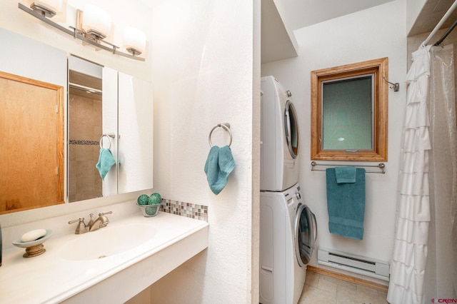 37 Verde Ln, Durango, CO 81301 - bathroom with a baseboard heating unit, estacked washer and dryer, a shower with shower curtain, vanity, and tile patterned flooring