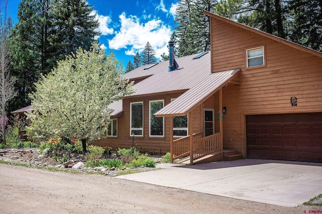 37 Verde Ln, Durango, CO 81301 - view of front of house with a standing seam roof, driveway, and metal roof