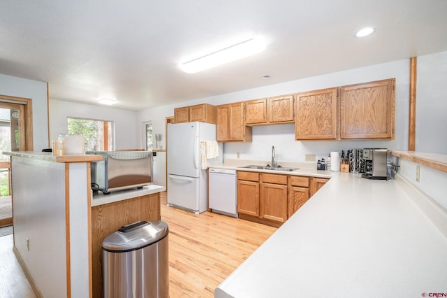 37 Verde Ln, Durango, CO 81301 - kitchen with white appliances, a sink, light wood-style flooring, light countertops, and recessed lighting