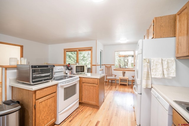 37 Verde Ln, Durango, CO 81301 - kitchen with white appliances, light wood-style floors, and light countertops