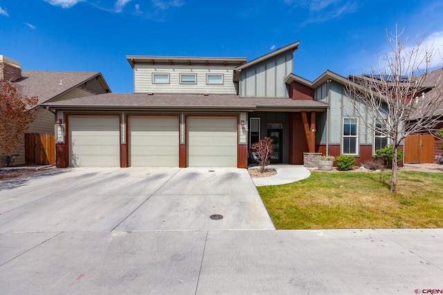 2488 Josefine Ln, Grand Junction, CO 81505 - view of front of house with concrete driveway, board and batten siding, and an attached garage