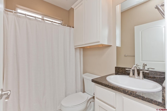2488 Josefine Ln, Grand Junction, CO 81505 - bathroom featuring toilet, vanity, and curtained shower