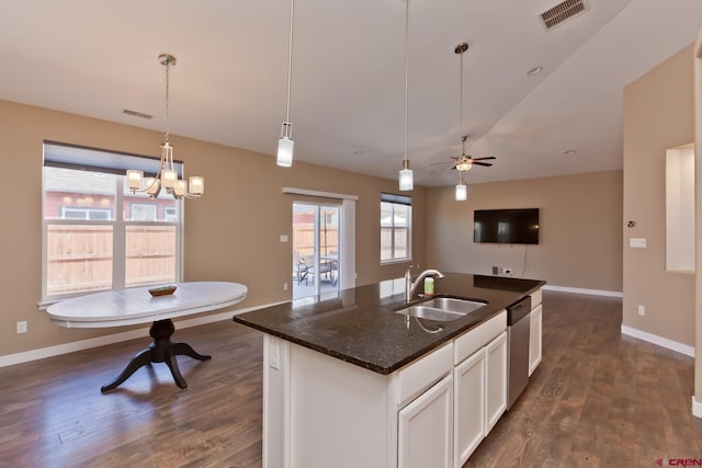 2488 Josefine Ln, Grand Junction, CO 81505 - kitchen with a sink, stainless steel dishwasher, dark wood-style flooring, open floor plan, and baseboards