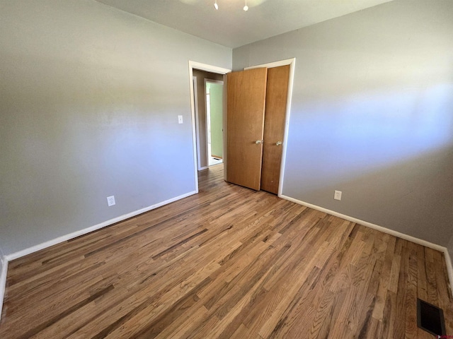 608 Alameda Dr, Cortez, CO 81321 - unfurnished room with baseboards and wood finished floors