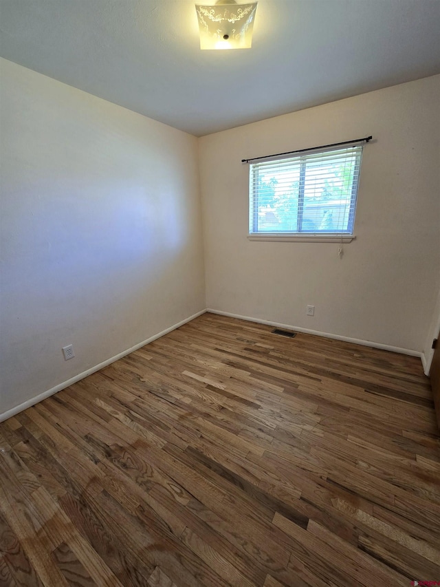608 Alameda Dr, Cortez, CO 81321 - unfurnished room with wood finished floors and baseboards