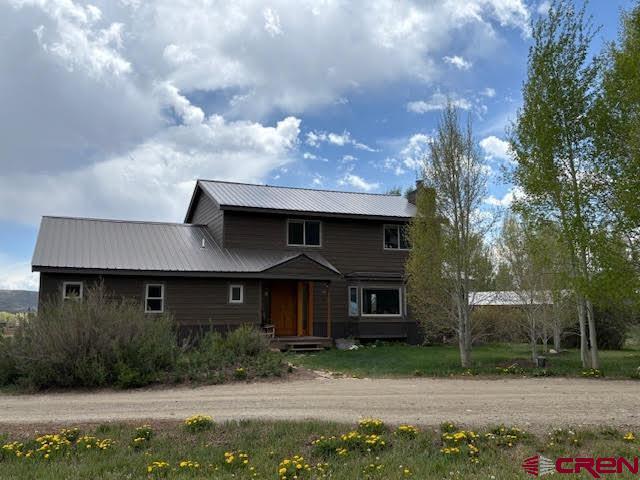 250 Pashuta Dr, Gunnison, CO 81230 - view of front of house featuring metal roof