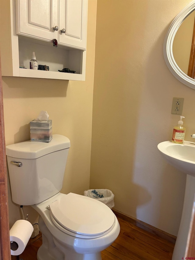 250 Pashuta Dr, Gunnison, CO 81230 - half bath featuring toilet, wood finished floors, and baseboards