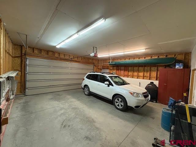 250 Pashuta Dr, Gunnison, CO 81230 - garage featuring a garage door opener