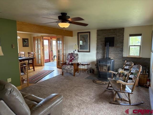 250 Pashuta Dr, Gunnison, CO 81230 - living room with a wood stove and a ceiling fan