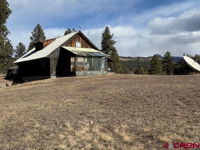 157 S Primrose Ridge Pl, Pagosa Springs, CO 81147 - view of home's exterior with an outbuilding