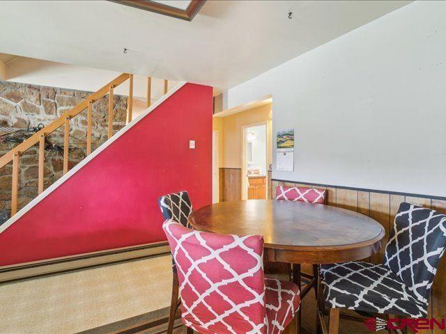 157 S Primrose Ridge Pl, Pagosa Springs, CO 81147 - dining room featuring stairway and wainscoting