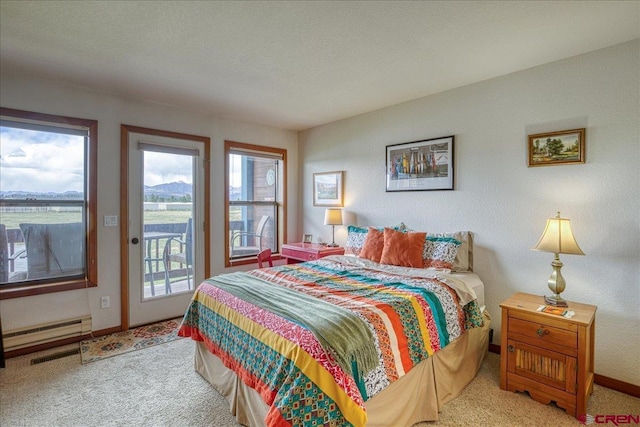 88 W Peregrine Cir Unit 4Unit 1, Pagosa Springs, CO 81147 - bedroom featuring access to exterior, carpet flooring, and baseboard heating
