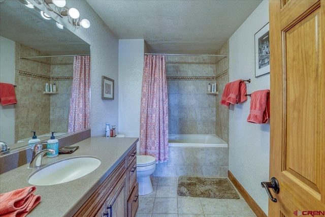 88 W Peregrine Cir Unit 4Unit 1, Pagosa Springs, CO 81147 - bathroom featuring vanity, tiled shower / bath, a textured ceiling, toilet, and tile patterned floors