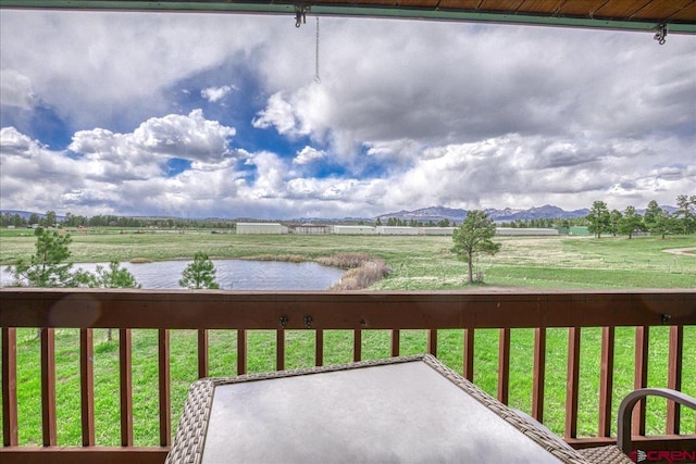 88 W Peregrine Cir Unit 4Unit 1, Pagosa Springs, CO 81147 - wooden deck with a water and mountain view and a yard