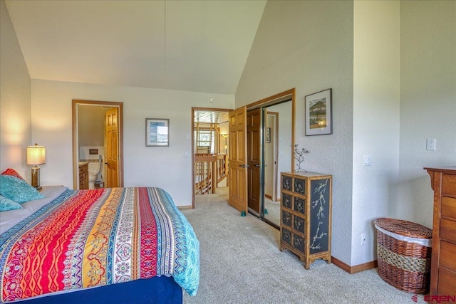 88 W Peregrine Cir Unit 4Unit 1, Pagosa Springs, CO 81147 - bedroom with light carpet, a closet, ensuite bath, baseboards, and high vaulted ceiling