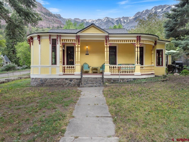 445 4th St, Ouray, CO 81427 - view of front of home with a porch and a mountain view
