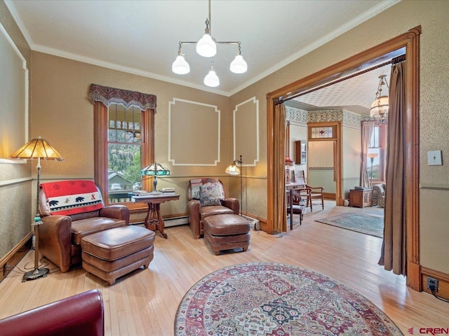 445 4th St, Ouray, CO 81427 - living area featuring a chandelier, wood finished floors, and ornamental molding