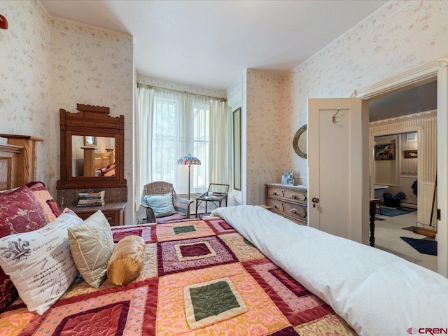 445 4th St, Ouray, CO 81427 - bedroom featuring wallpapered walls and a baseboard heating unit