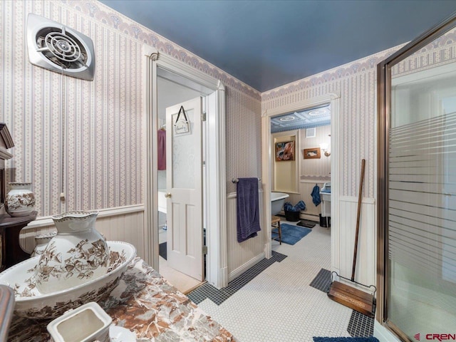 445 4th St, Ouray, CO 81427 - bathroom featuring a wainscoted wall and wallpapered walls