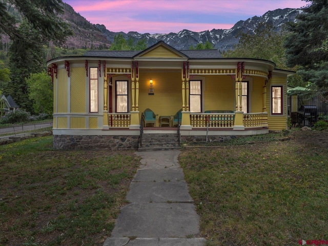 445 4th St, Ouray, CO 81427 - view of front facade with a mountain view and a porch